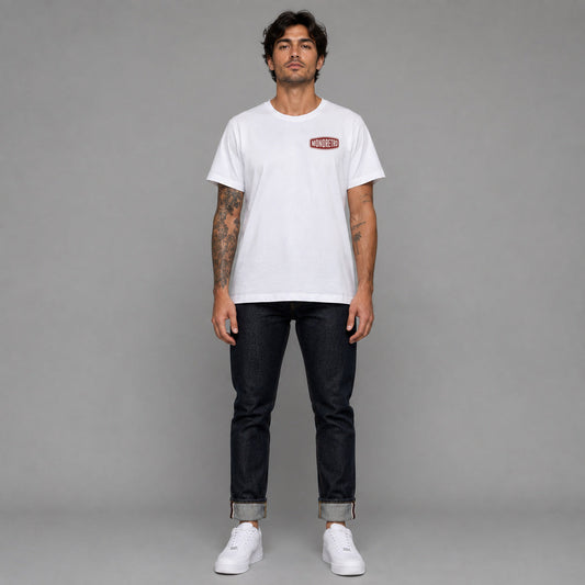 Signature No1 in white — worn by a male model, full length.