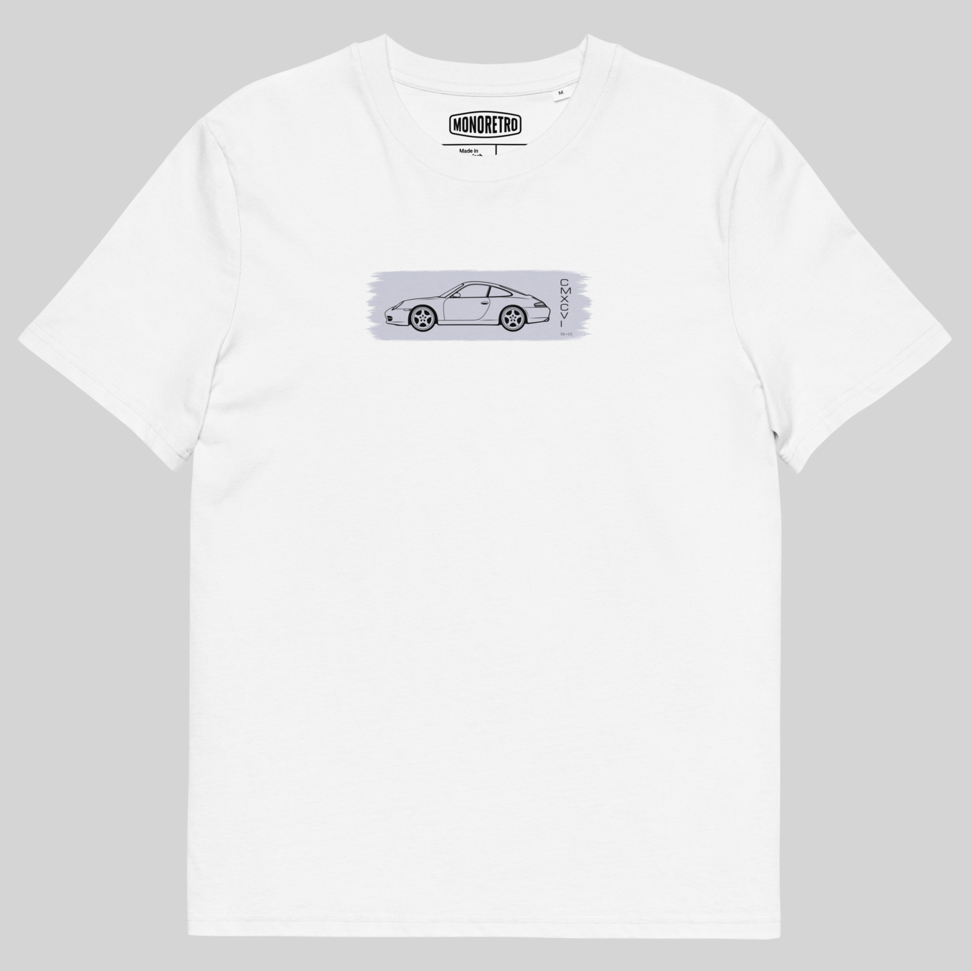 A white short-sleeve crewneck t-shirt featuring a horizontal graphic print of a silver sports car on a light gray textured background, with the 'MONSTER' brand logo printed inside the collar.