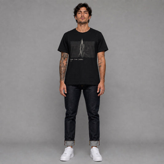 Bass Line Junky in black — worn by a male model, full length.