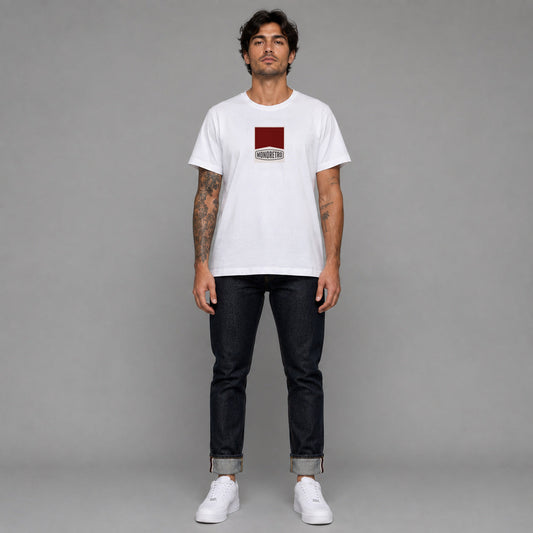 Racing in white — worn by a male model, full length.
