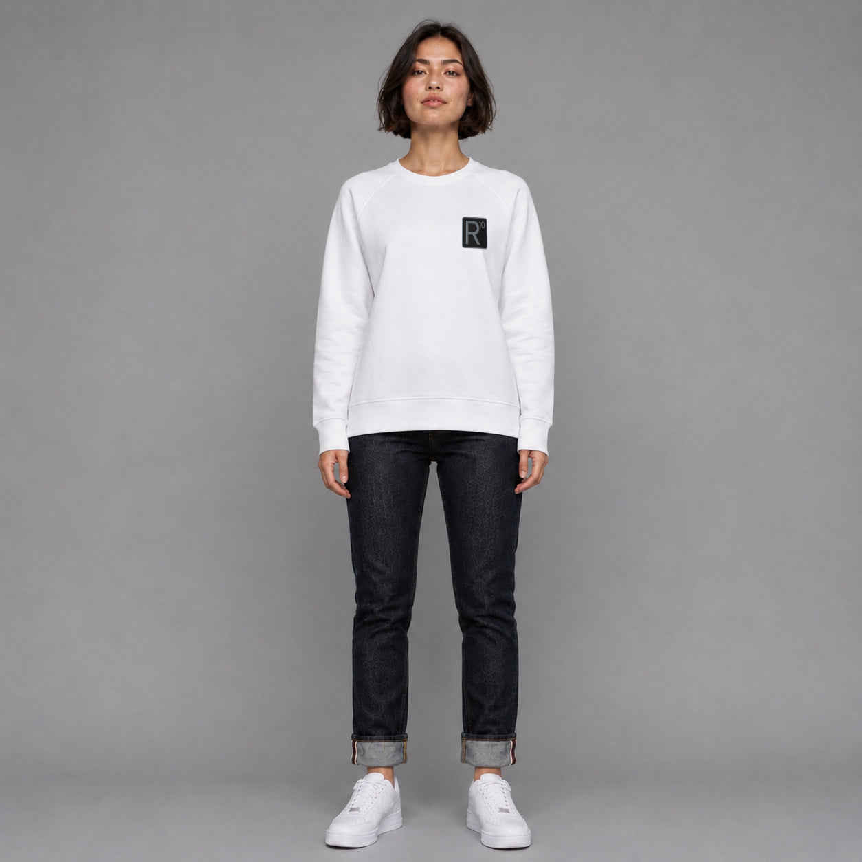 R10 Classic in white — worn by a female model, full length.