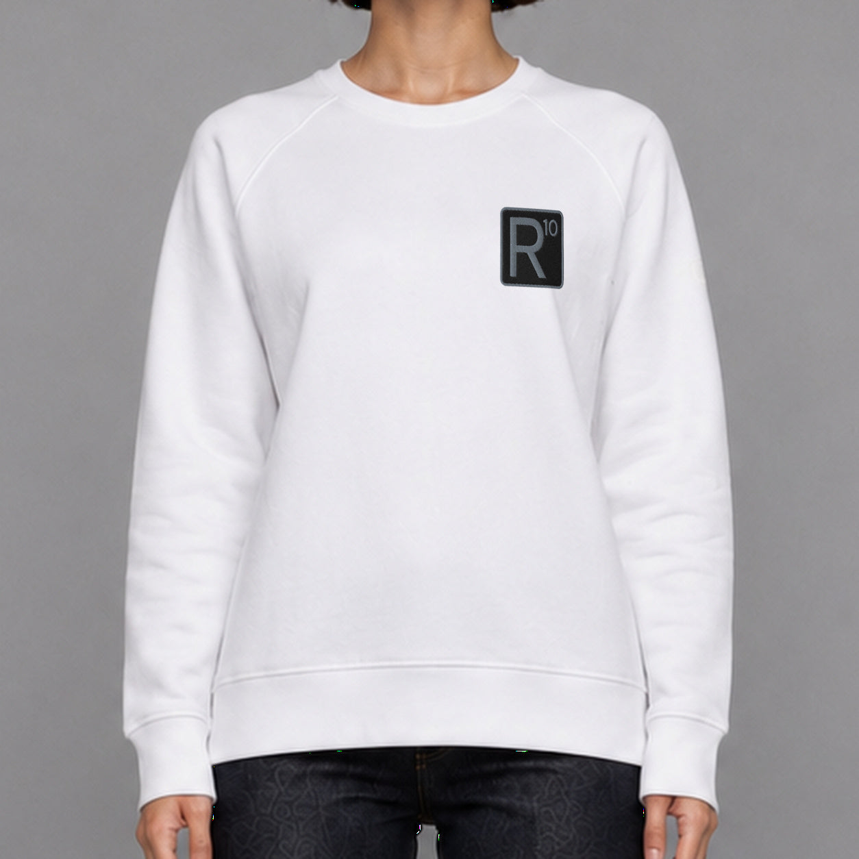 R10 Classic in white — worn by a female model, front detail.