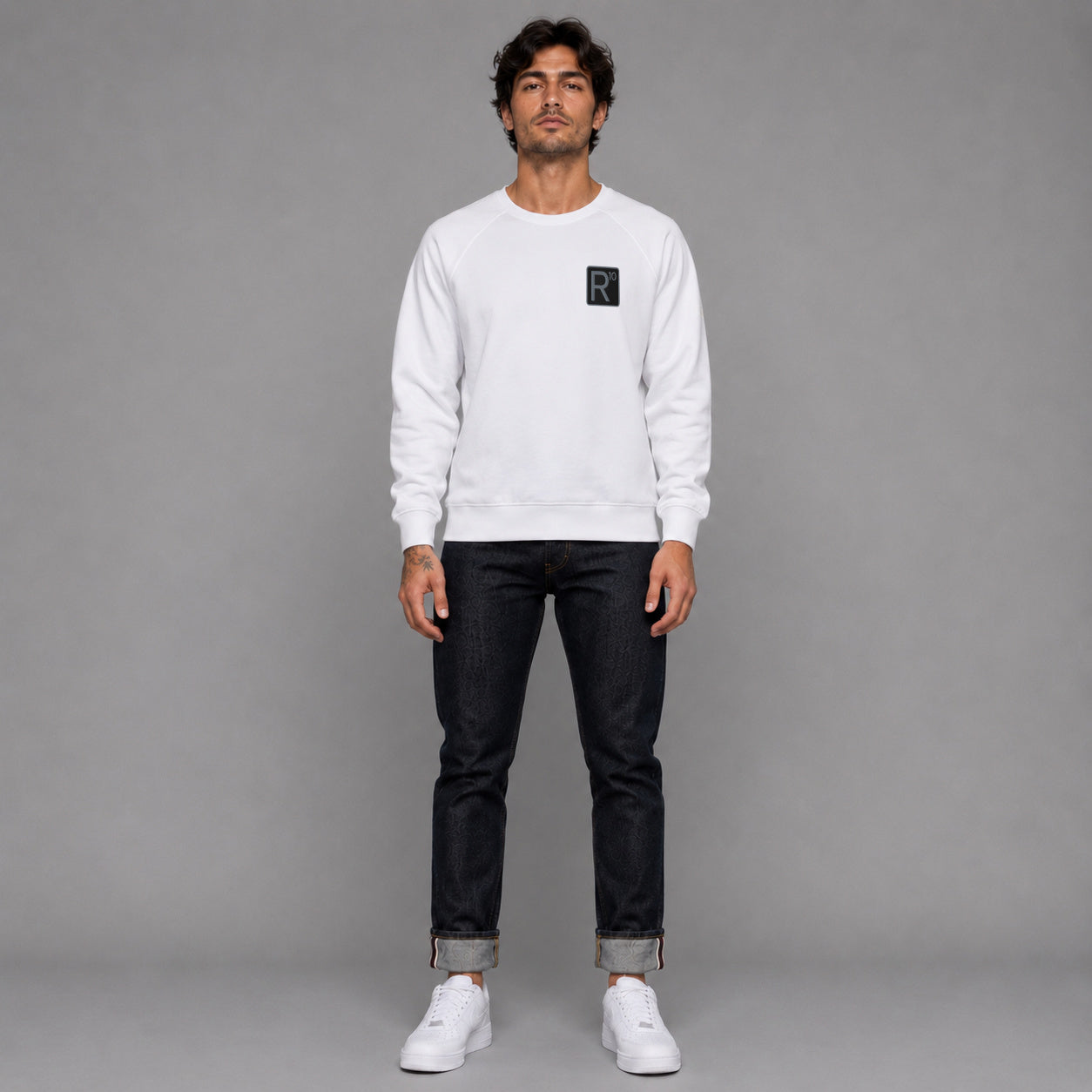 R10 Classic in white — worn by a male model, full length.