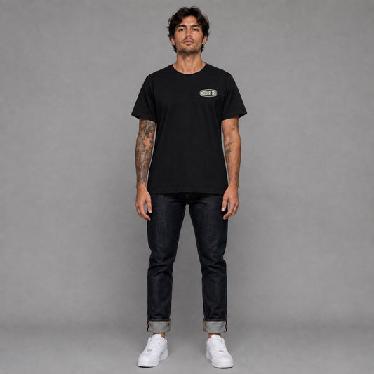 Signature No5 in black — worn by a male model, full length.