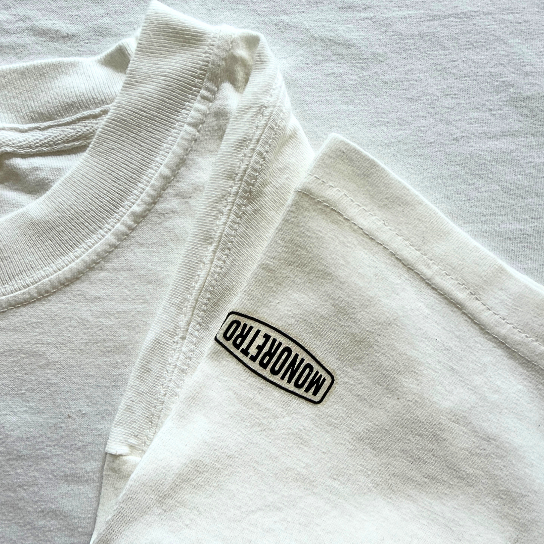 MONORETRO heavyweight garment-dyed cotton T-shirt showing the vintage tube knit construction with no side seams.
